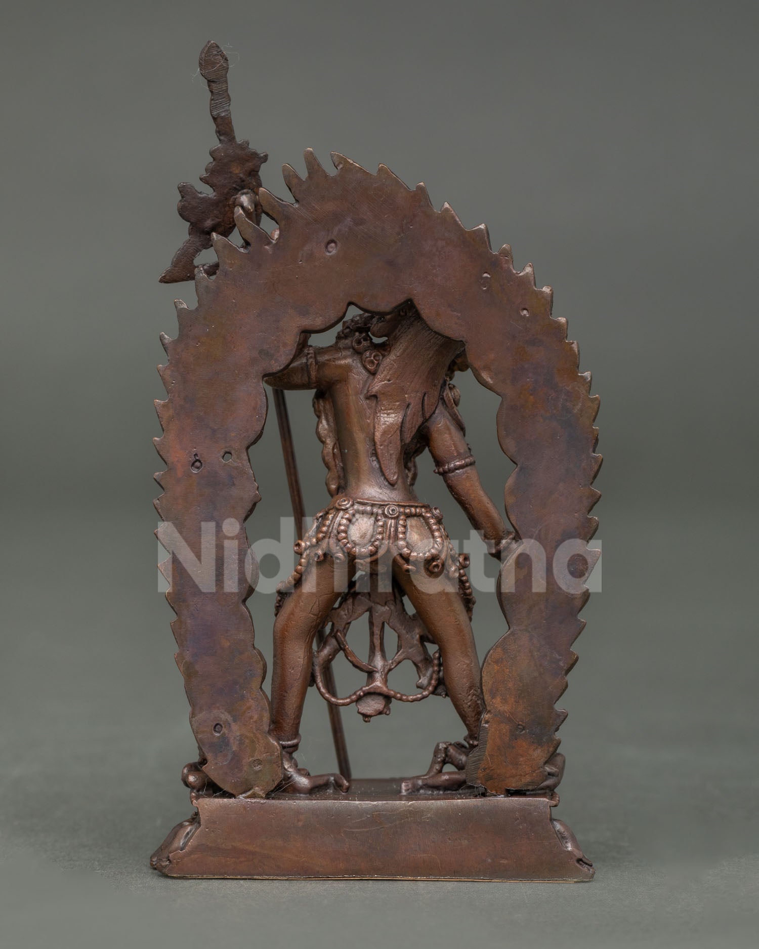 Back view of handcrafted Vajrayogini statue from Nepal showcasing oxidized copper and traditional lost wax craftsmanship