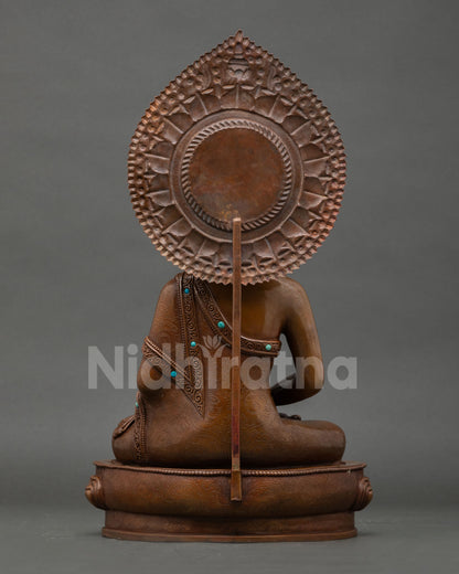 Back view of handmade Amitabha Buddha statue from Nepal showcasing copper artistry and sacred Himalayan Buddhist details
