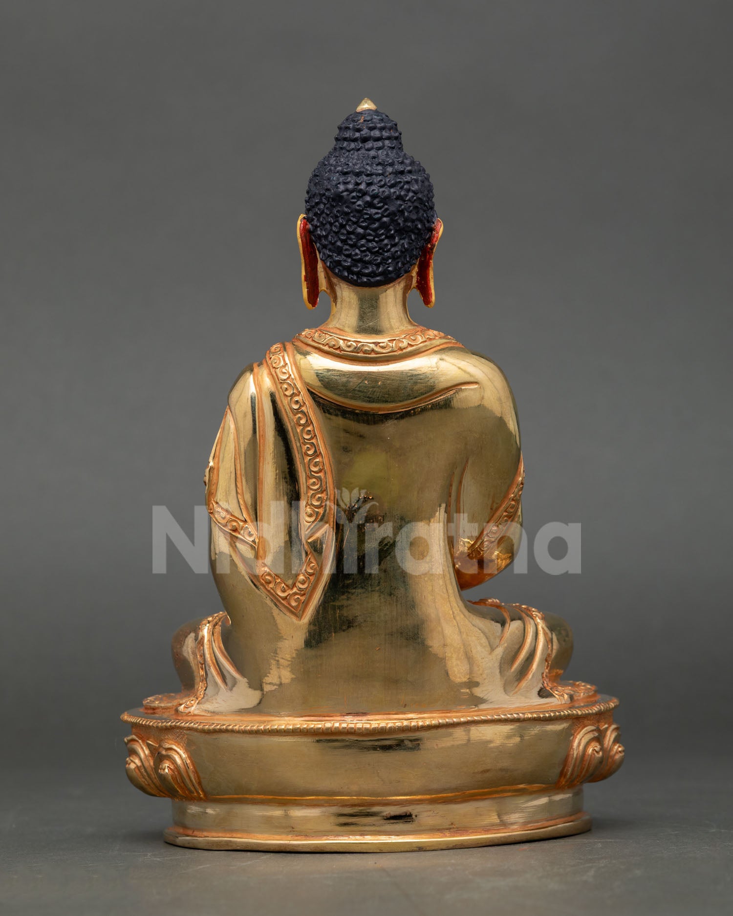 Back view of handmade Nepalese Amitabha Buddha sculpture with gold fire gilding