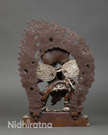 Back view of Hayagriva statue ornate robe lotus base silver plated Buddhist decor Nepal