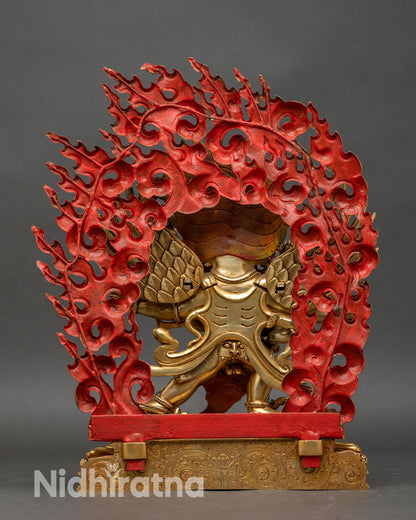 Back view of hayagriva statue with spread wings, flaming halo, and sacred artwork