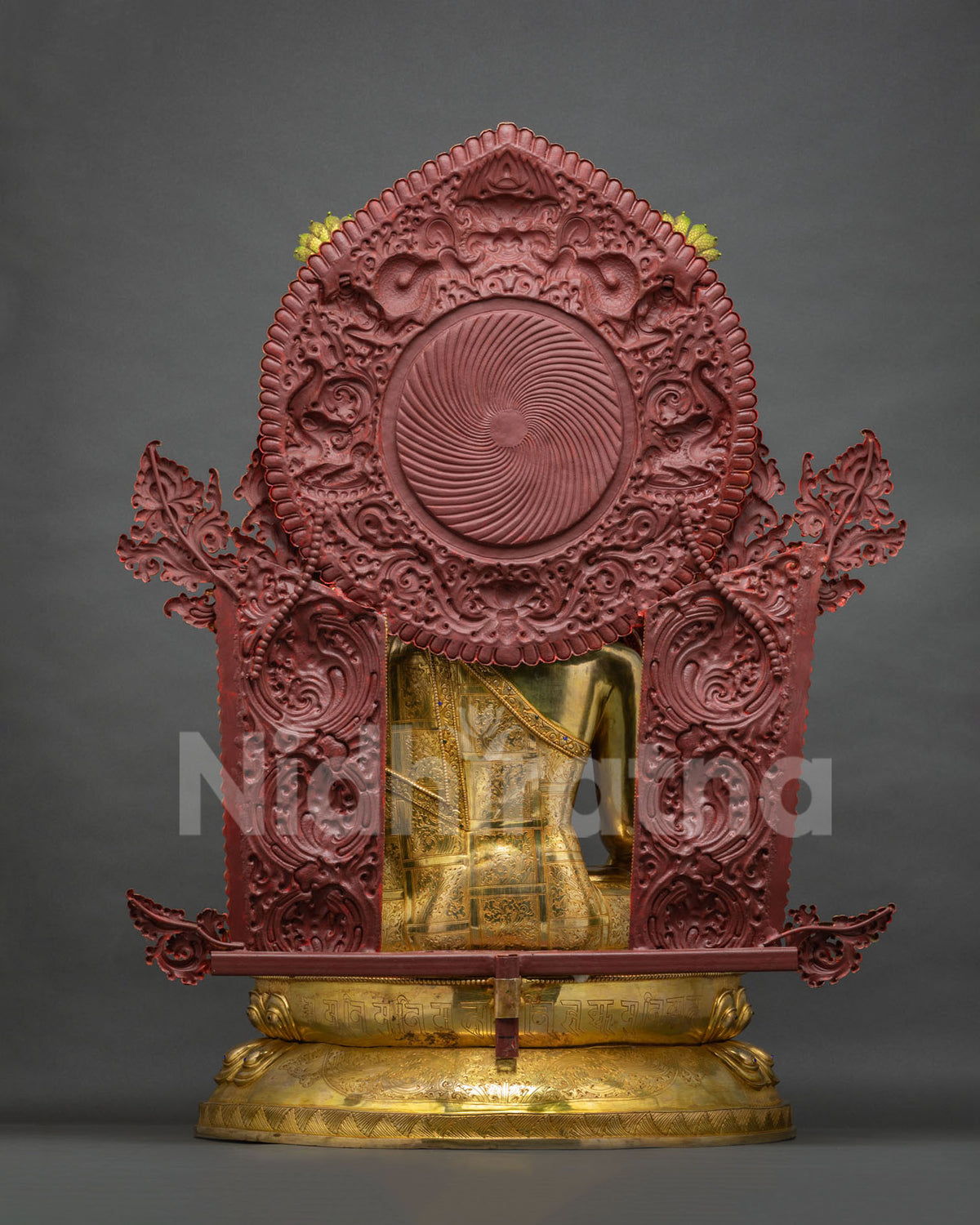 Back view of Jowo Rinpoche statue showing gold robe and red painted halo
