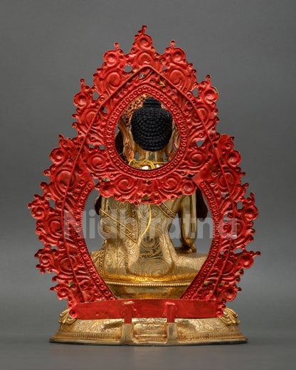 Back view of Jowo Rinpoche statue with intricate monk robe detailing floral patterns and traditional Nepalese Buddhist metalwork art