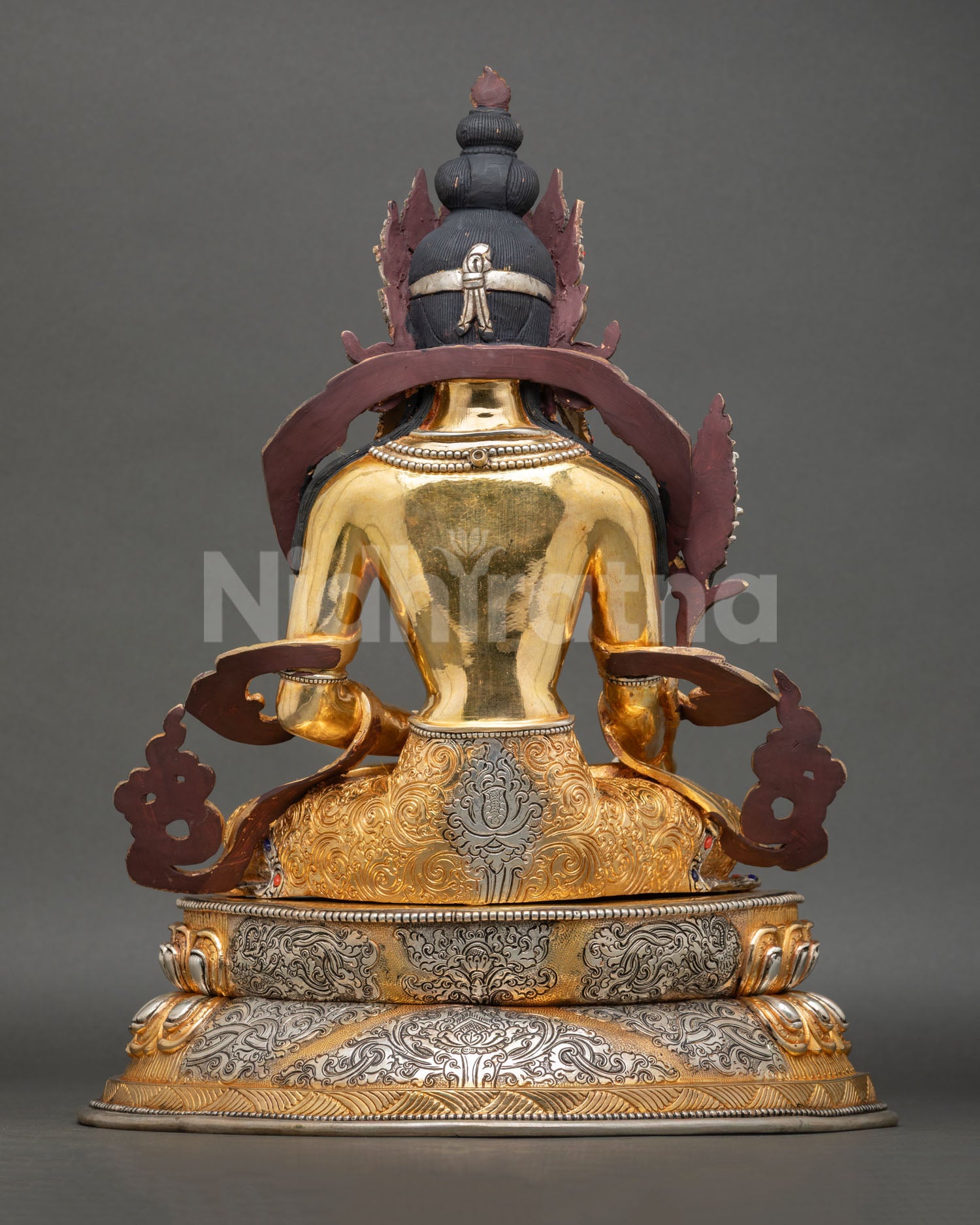 Back view of Kshitigarbha statue intricate detailing copper body gold gilding repoussé work gemstone inlay Tibetan Buddhist meditation sculpture