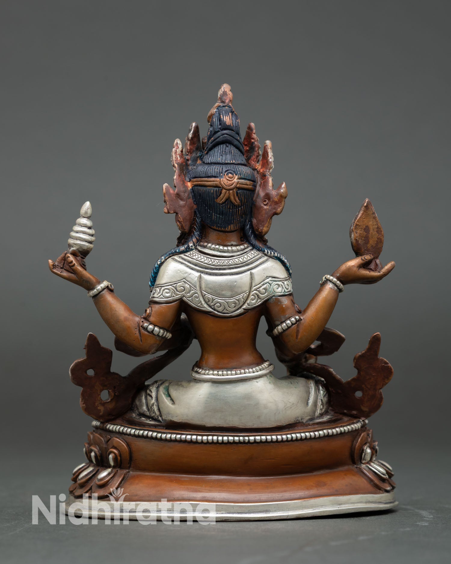 Back view of Laxmi statue oxidized silver finish copper sculpture detailed carving Patan Nepal traditional art
