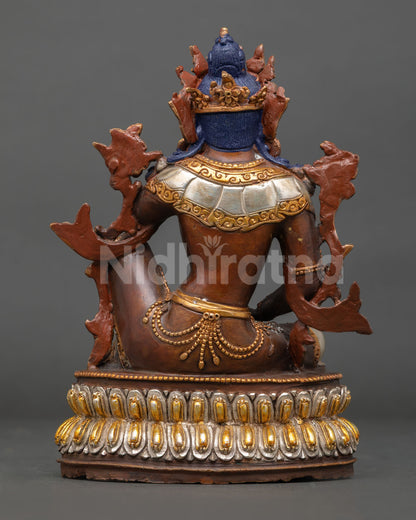 Back view Lokeshvara statue revealing detailed carving, lotus base design, and oxidized copper patina