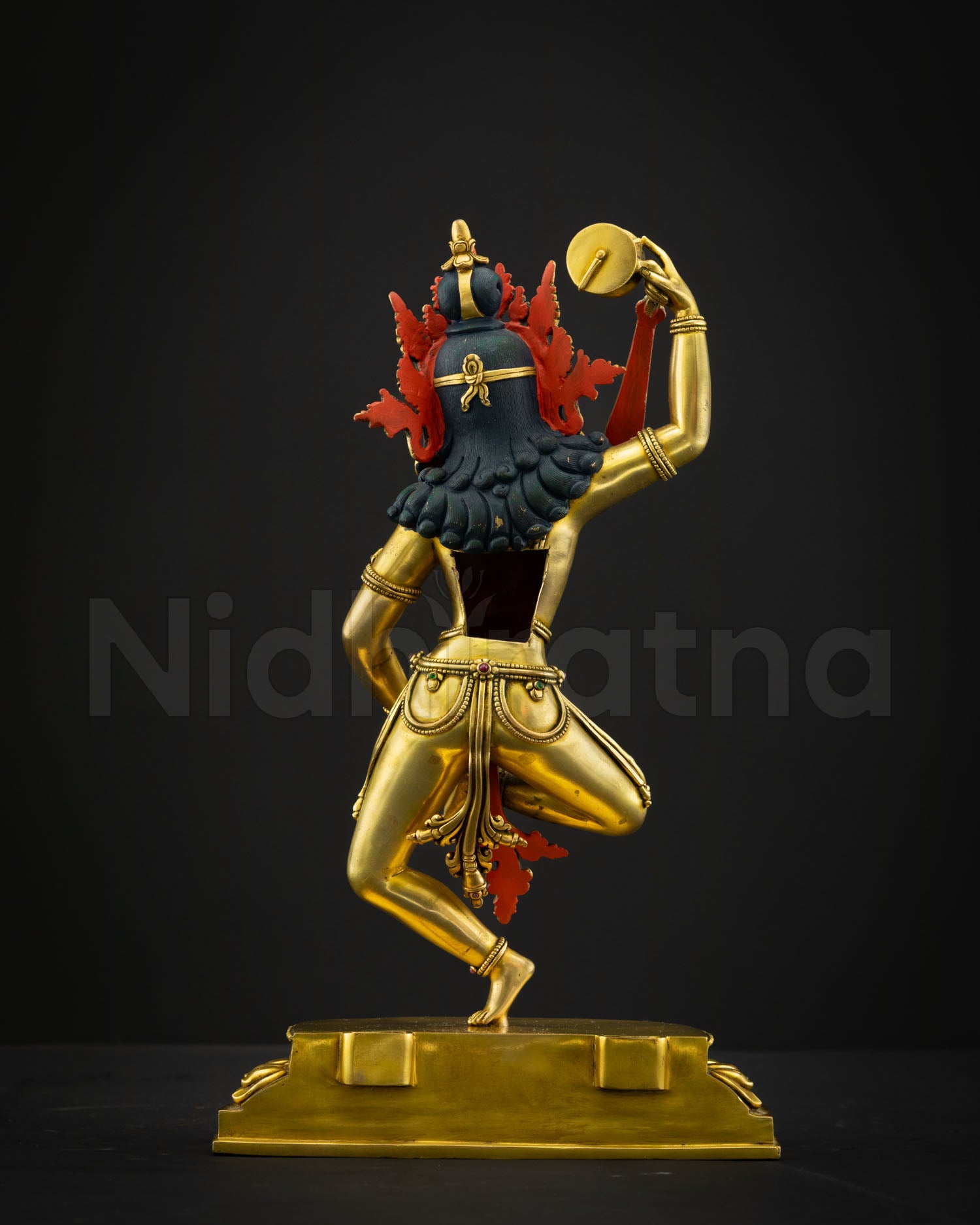 Back view Machig Labdron statue showing intricate sculptural detailing flowing robes and radiant 24K gold gilded Himalayan craftsmanship