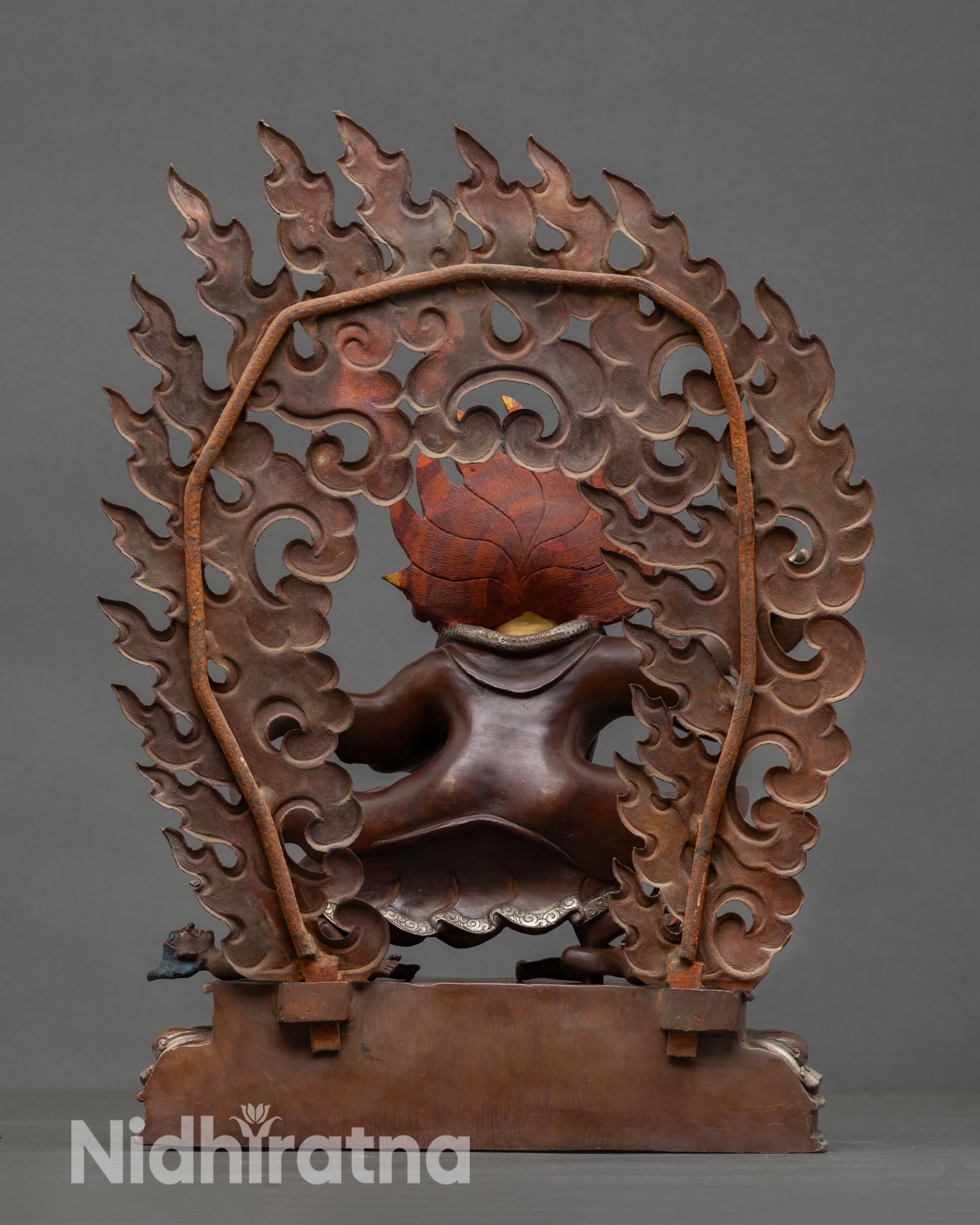 Back view of Mahakala Bernagchen sculpture intricate detailing copper artwork Tibetan protector deity ritual meditation altar spiritual decor