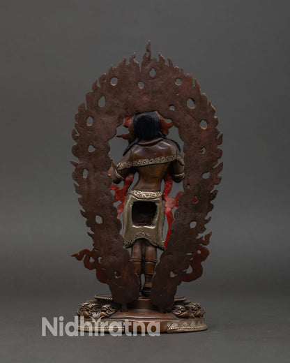 Back view of Mandarava statue, Himalayan Buddhist dakini art, Patan handmade copper figure, silver plated detailing, sacred Vajrayana altar sculpture