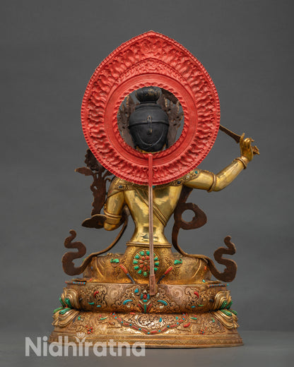 Back view of Manjushri statue double lotus base intricate repoussé work beaded border semi precious stones coral turquoise Himalayan sacred Buddhist art