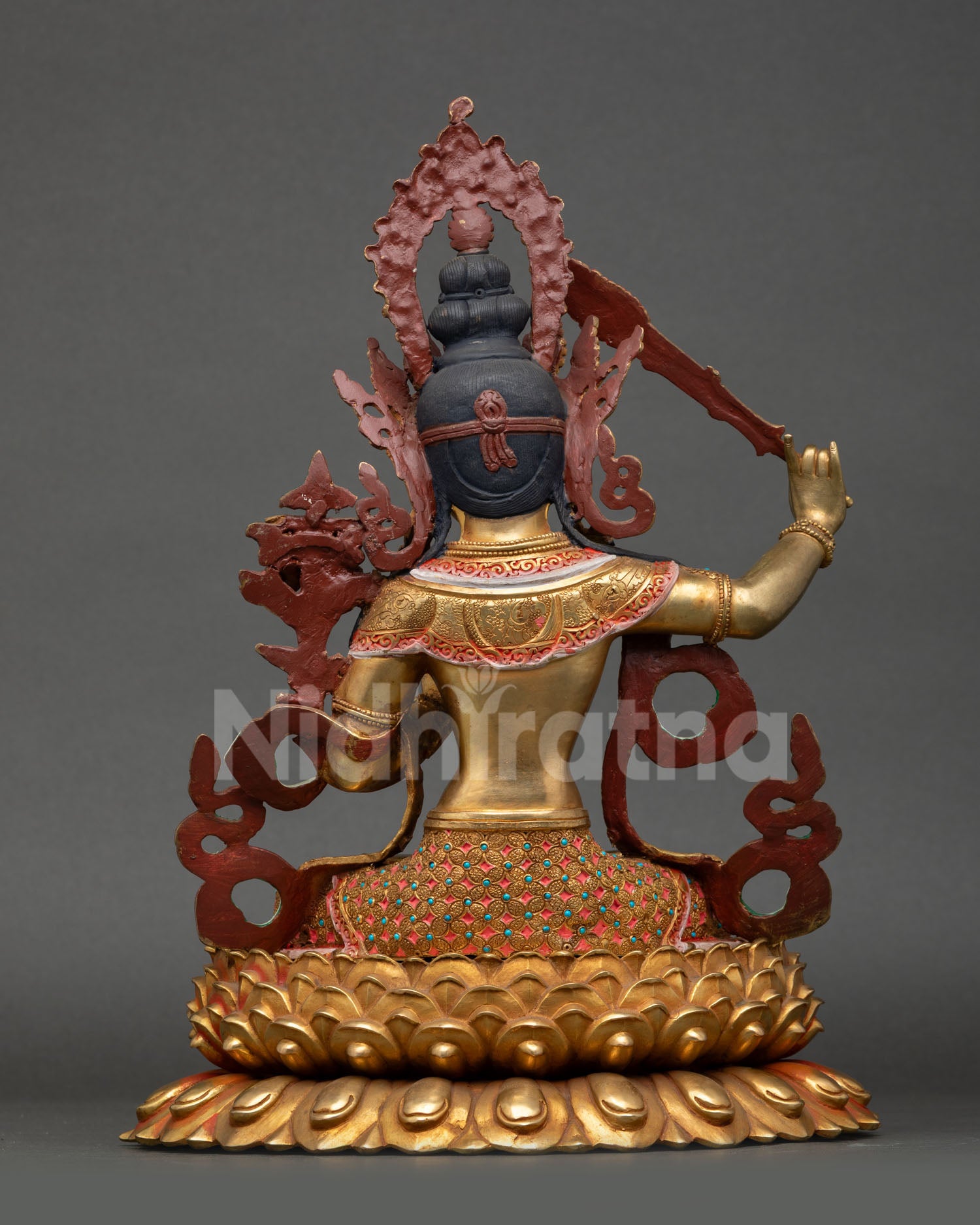 Back view of Manjushri statue lotus throne halo design Himalayan craftsmanship sacred altar sculpture wisdom deity Nepal handmade spiritual interior decor