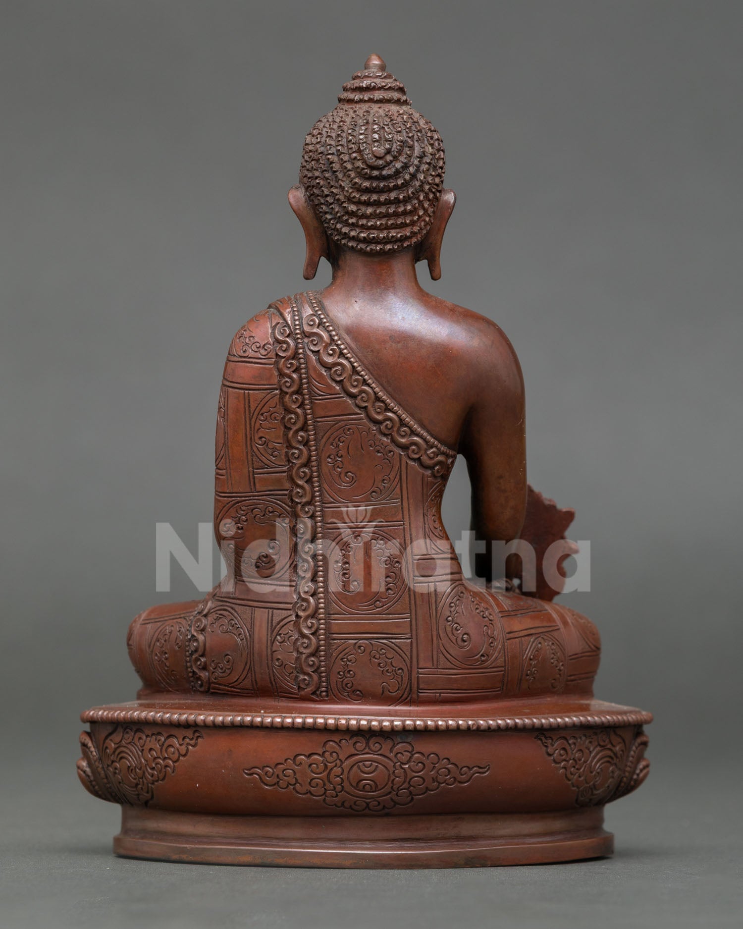 Back view of Medicine Buddha statue oxidized copper Himalayan Buddhist healing deity handcrafted Nepal lost wax technique meditation altar decor