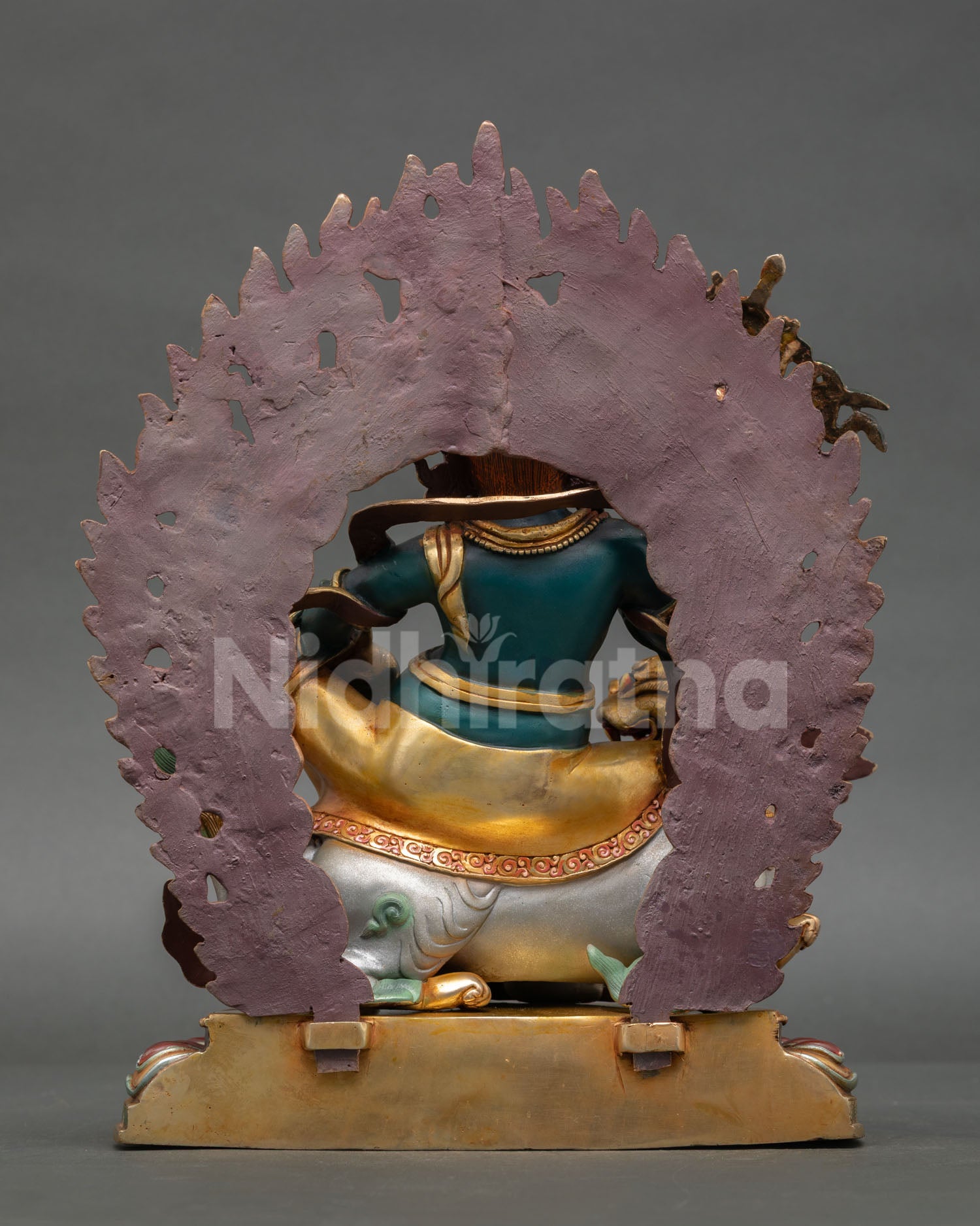 Back view Namtoshe statue Nepal handcrafted copper sculpture showing intricate back detailing halo