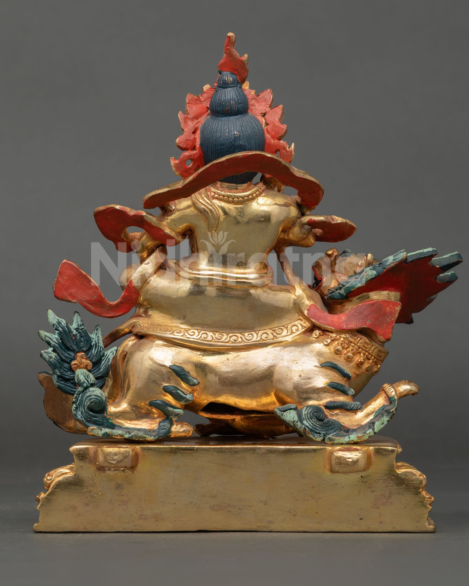Back view of Namtoshe Statue Nepal handmade sacred wealth deity sculpture gold gilded copper spiritual decor piece