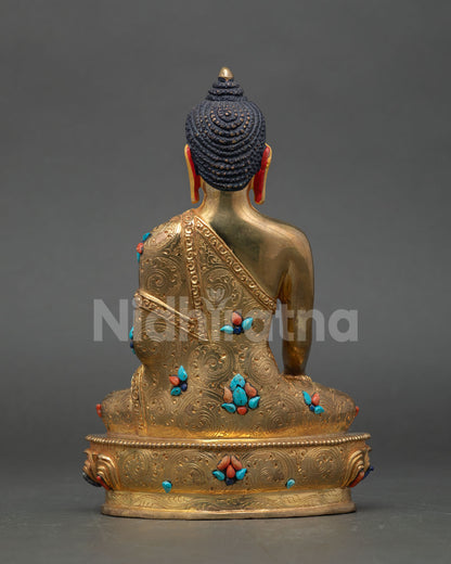 Back view of Nepalese Buddha Shakyamuni statue with gold gilded copper finish sacred Himalayan art