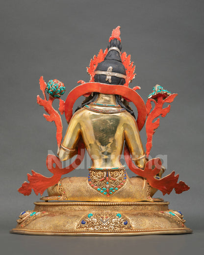 Back view of  Nepalese Green Tara sculpture with engraved metalwork lotus motifs and traditional artisan craftsmanship