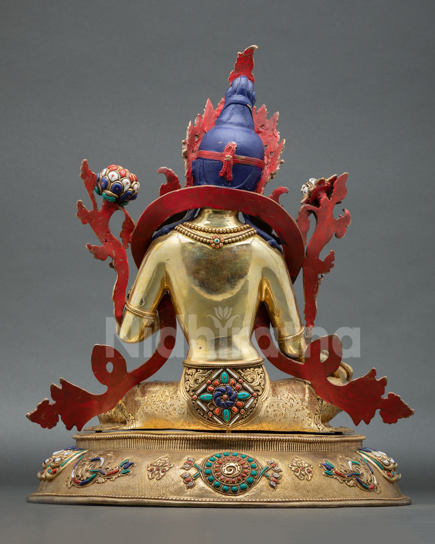 Back view of Nepalese Green Tara sculpture with intricate engraving sacred Buddhist iconography and spiritual artisan craftsmanship