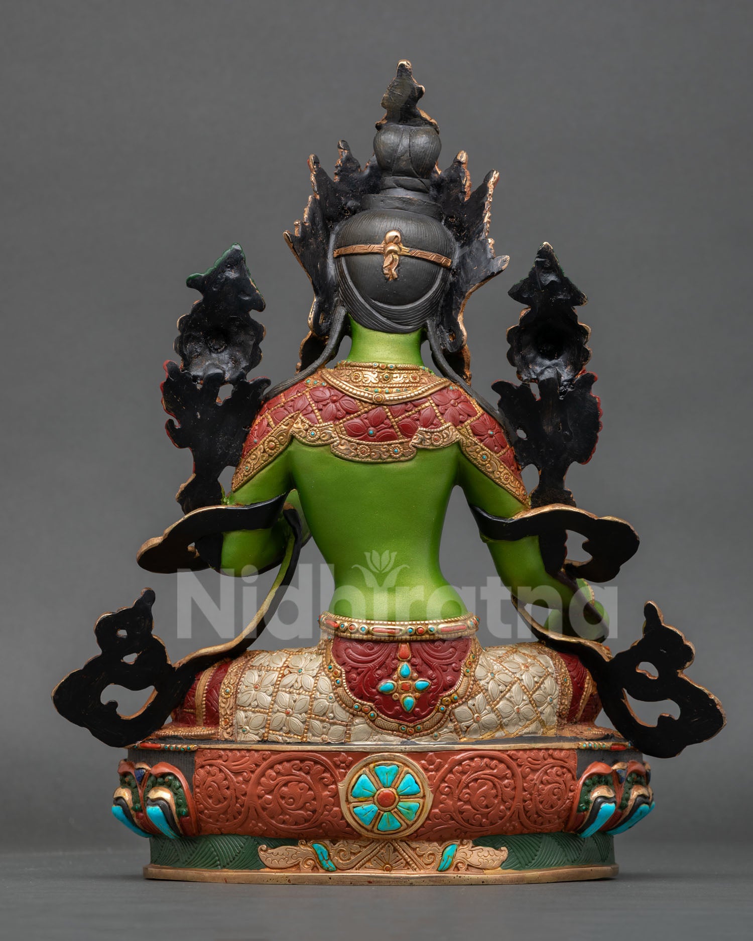 Back view of Nepalese Green Tara sculpture with ornate carvings lotus base and traditional Newari artistry