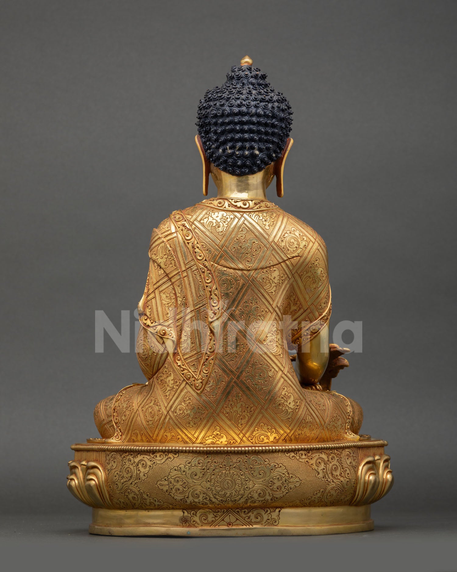 Back view of Nepalese Medicine Buddha statue in gold gilded copper designed for meditation space altar decor and spiritual wellness