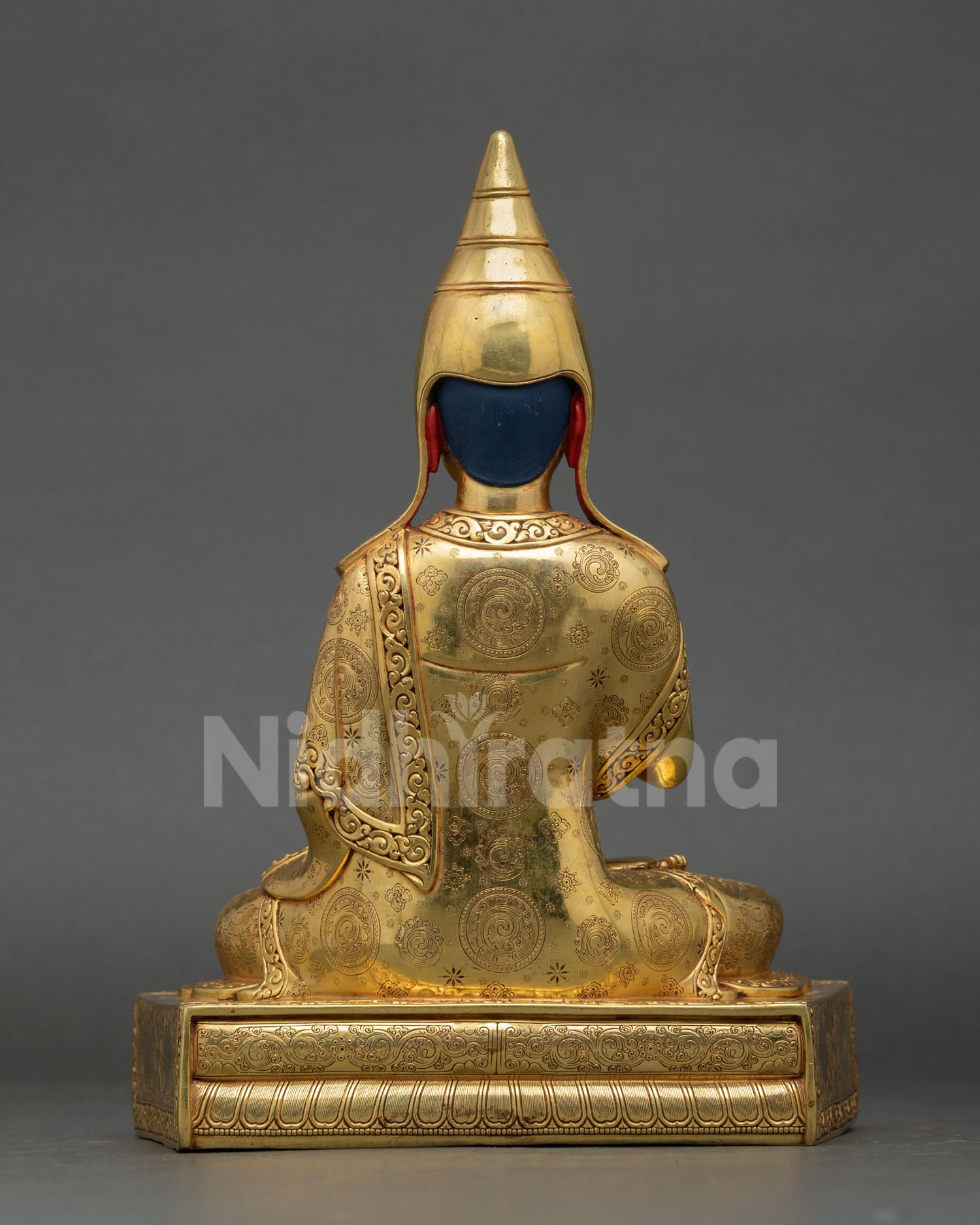 Back view of Nepalese Santaraksita statue on fire gilded copper base with intricate motifs for meditation and spiritual space decoration