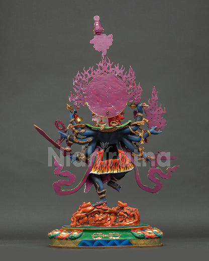 Back view of Nepalese Ucchusma copper statue with radiant flaming halo and miniature Buddha for meditation and tantric spiritual decor