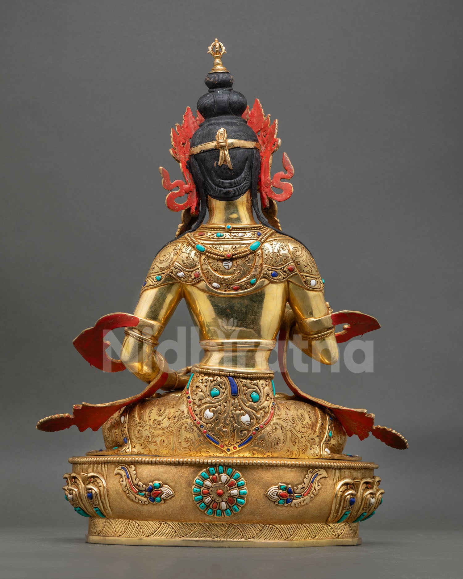 Back view of Nepalese Vajrasattva Buddhist sculpture with engraved lotus throne