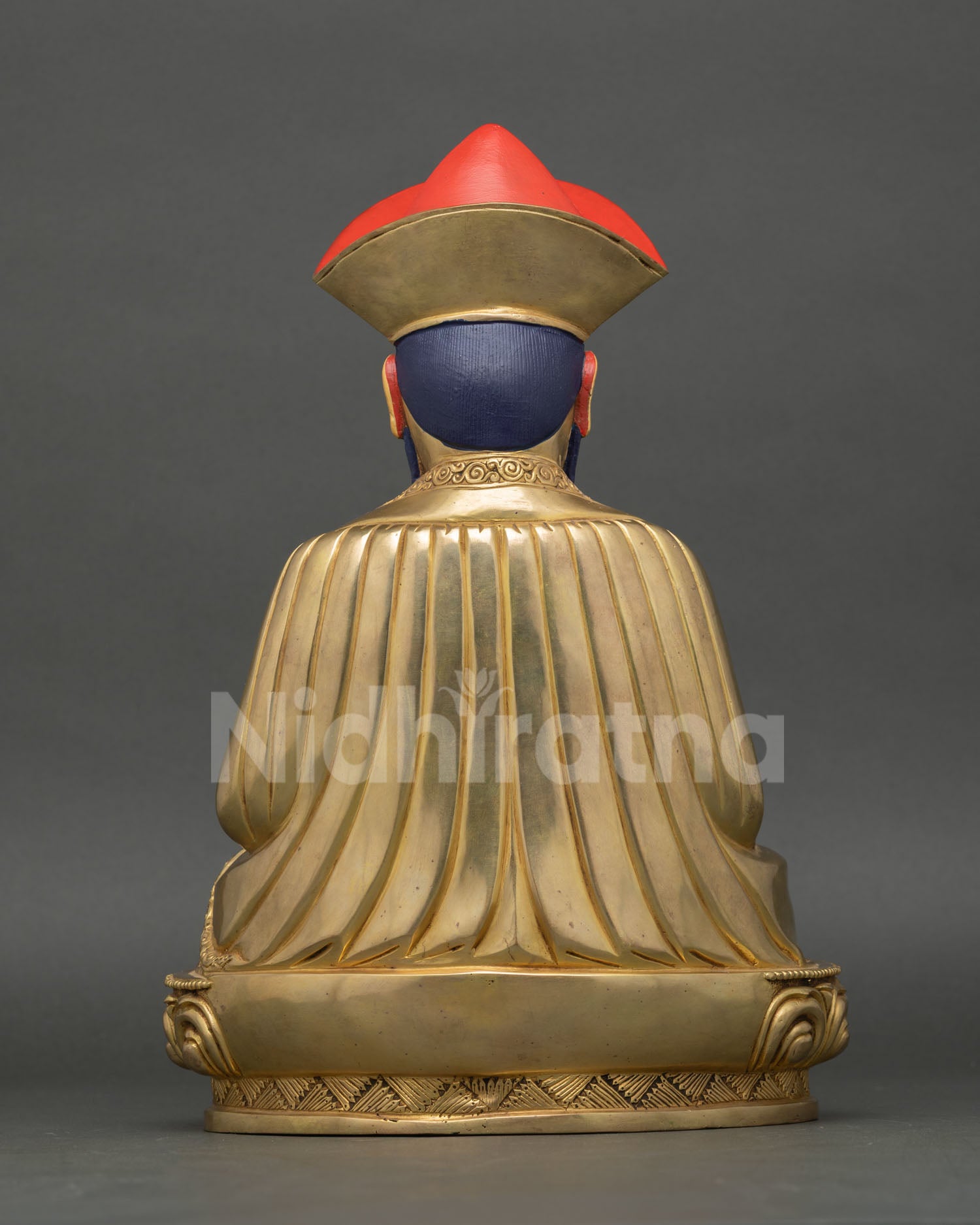 Back view of Ngawang Namgyal statue showing detailed monastic robe patterns