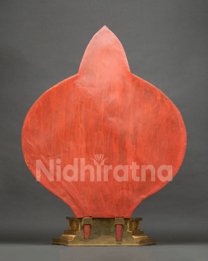 Back view of 1000-armed Chenrezig statue showing red-painted backdrop panel and copper base