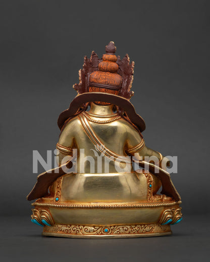 back view of 24K gold Dzambhala statue with detailed copper craftsmanship