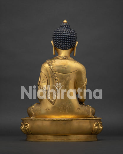back view of 24k gold fire gilded shakyamuni buddha statue ashtamangala carved robe nepal