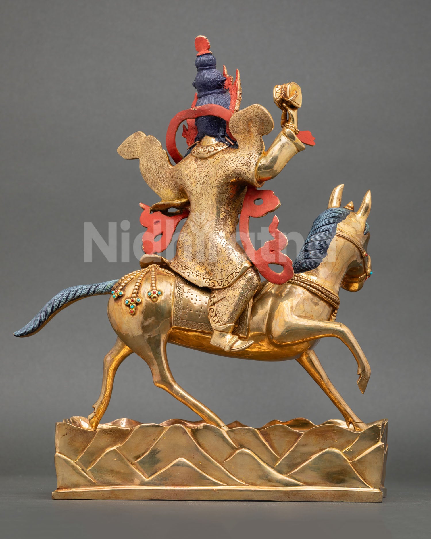 back view of achi chokyi drolma statue with detailed robes and decorative base engravings