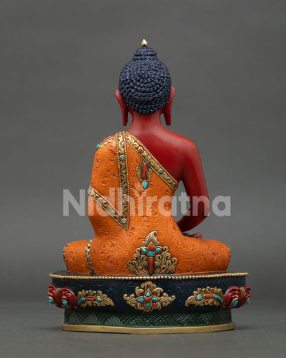 Back view of Amitabha Buddha statue showing detailed robe patterns and carvings