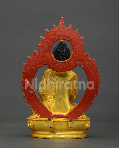 Back view of Amitabha Buddha statue showing red flame halo backing and gold robe