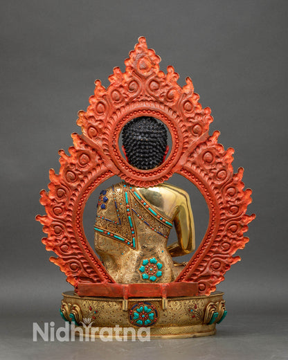 Back view of Amitabha Buddha statue with elaborate halo and ornate lotus pedestal
