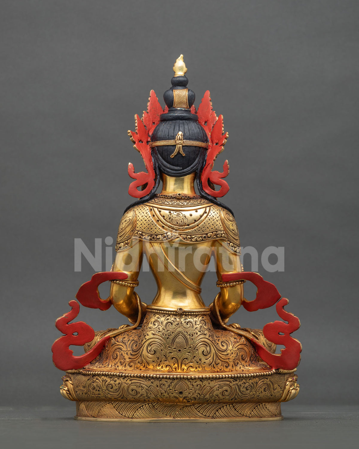 Back view of Amitayus Buddha statue showing hand-carved details and red painted accents