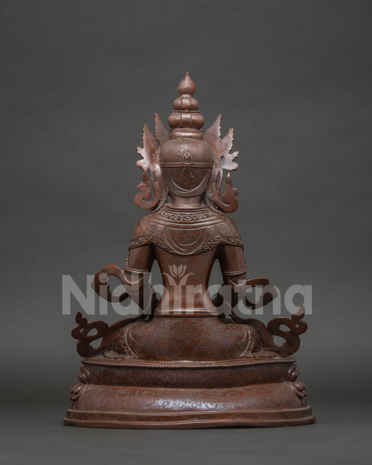 Back view of Amitayus Buddha statue showing lotus pedestal and robe detail