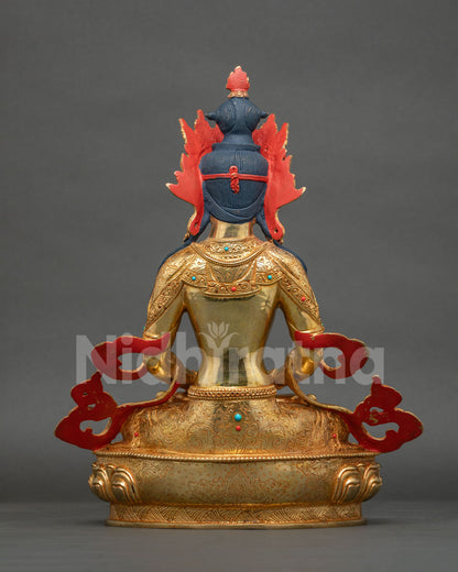 Back view of Amitayus Buddha statue with engraved gold robes and hand painted details, Nepal