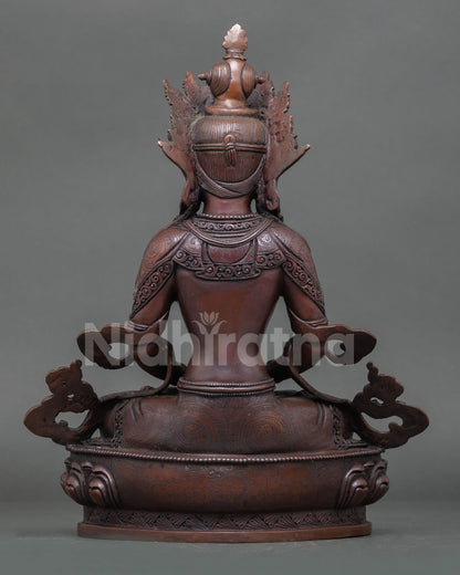 Back view of Amitayus statue showing detailed copper workmanship and aged patina finish