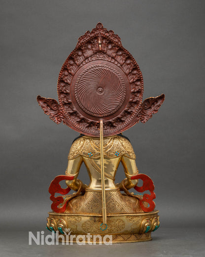 Back view of Amitayus statue showing detailed robe carvings and sacred halo design