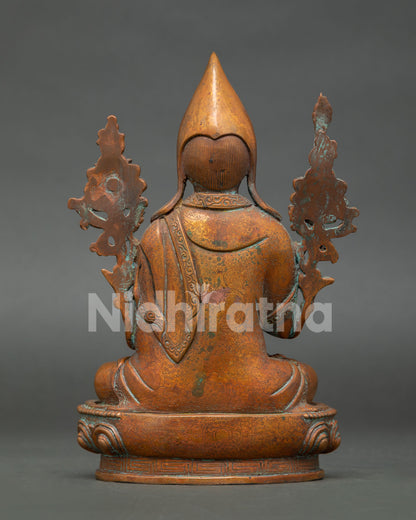 back view of antique finish tsongkhapa statue showing monastic robe details