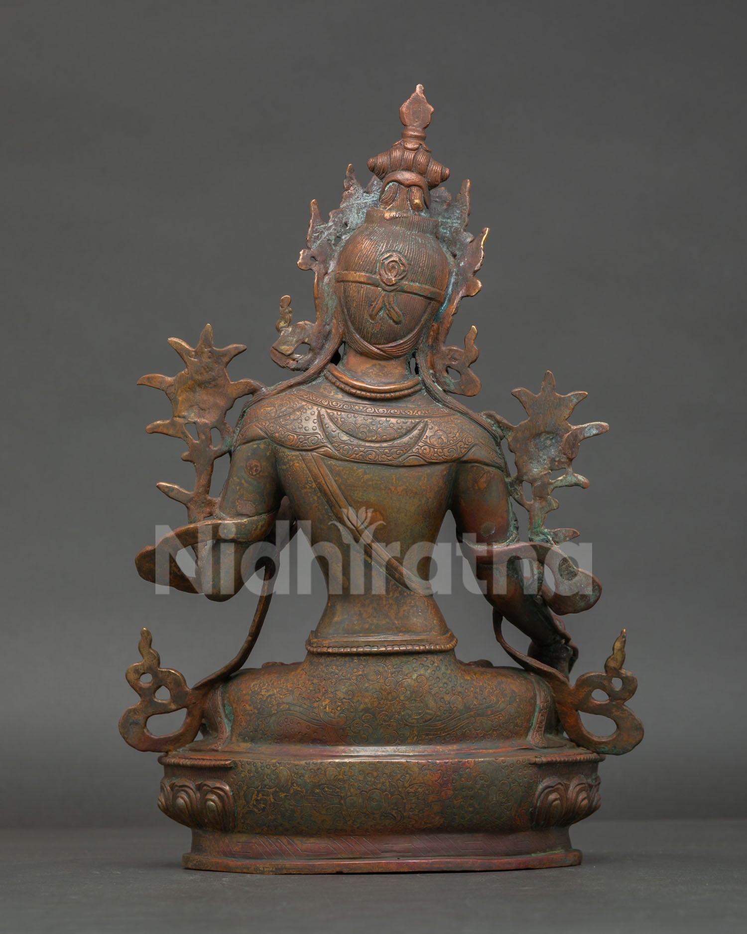 back view of antique white tara statue with detailed copper craftsmanship from nepal