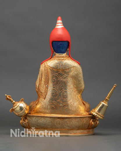 Back view of Atisha Dipankara statue showing detailed robes and lotus throne