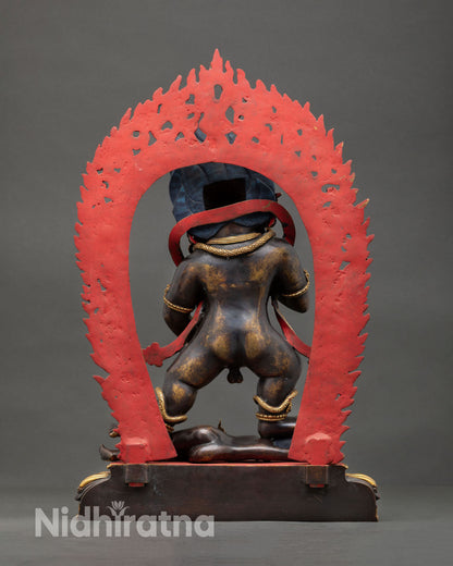 Back view of Black Dzambhala statue, copper metalwork, oxidized finish, gold ornaments, Nepal Newari craftsmanship