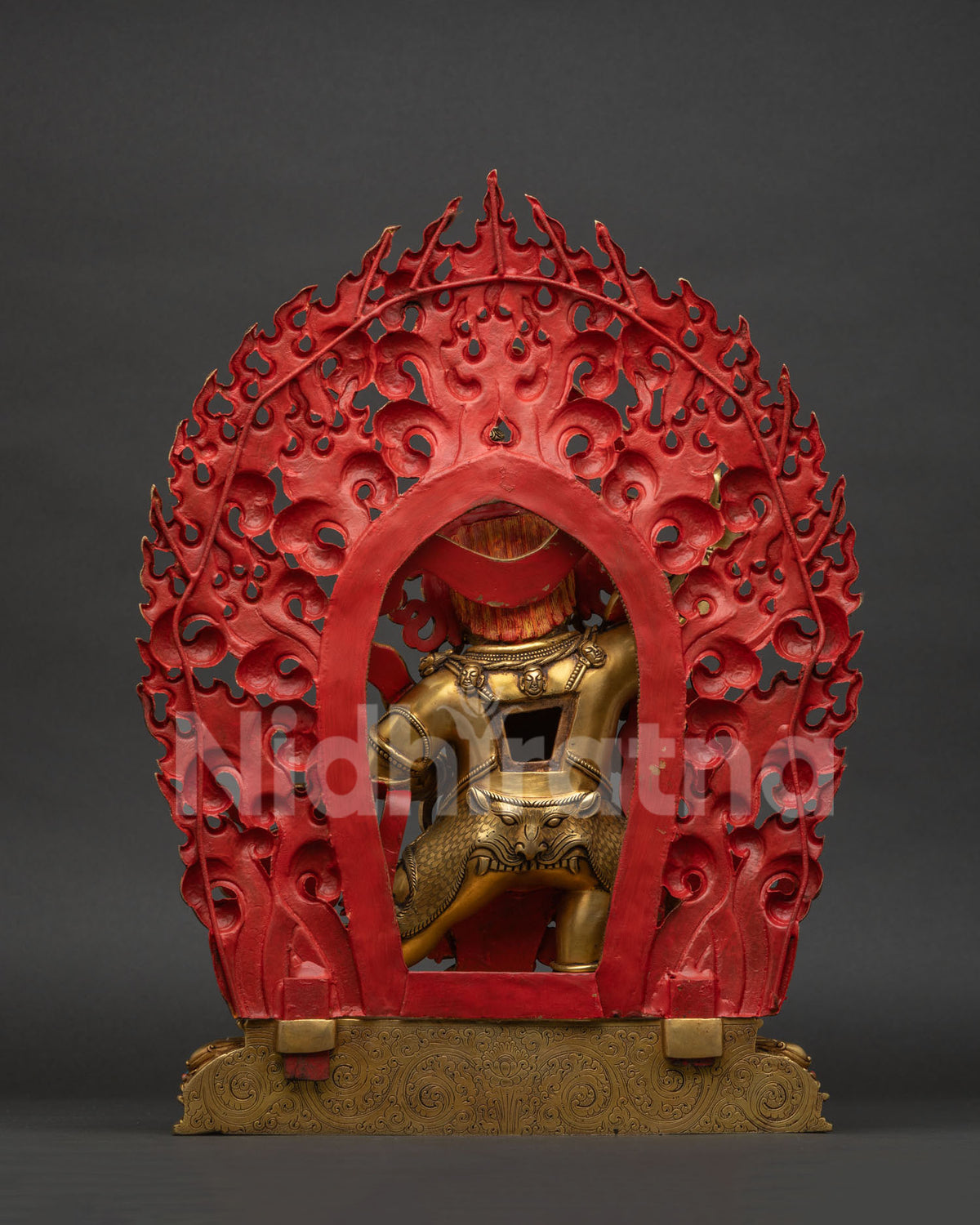Back view of Black Manjushri copper statue showing lotus pedestal and warrior stance
