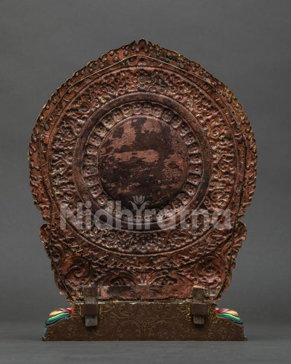 Back view of Black Manjushri statue showing lotus pedestal and gold fire-gilded halo detail