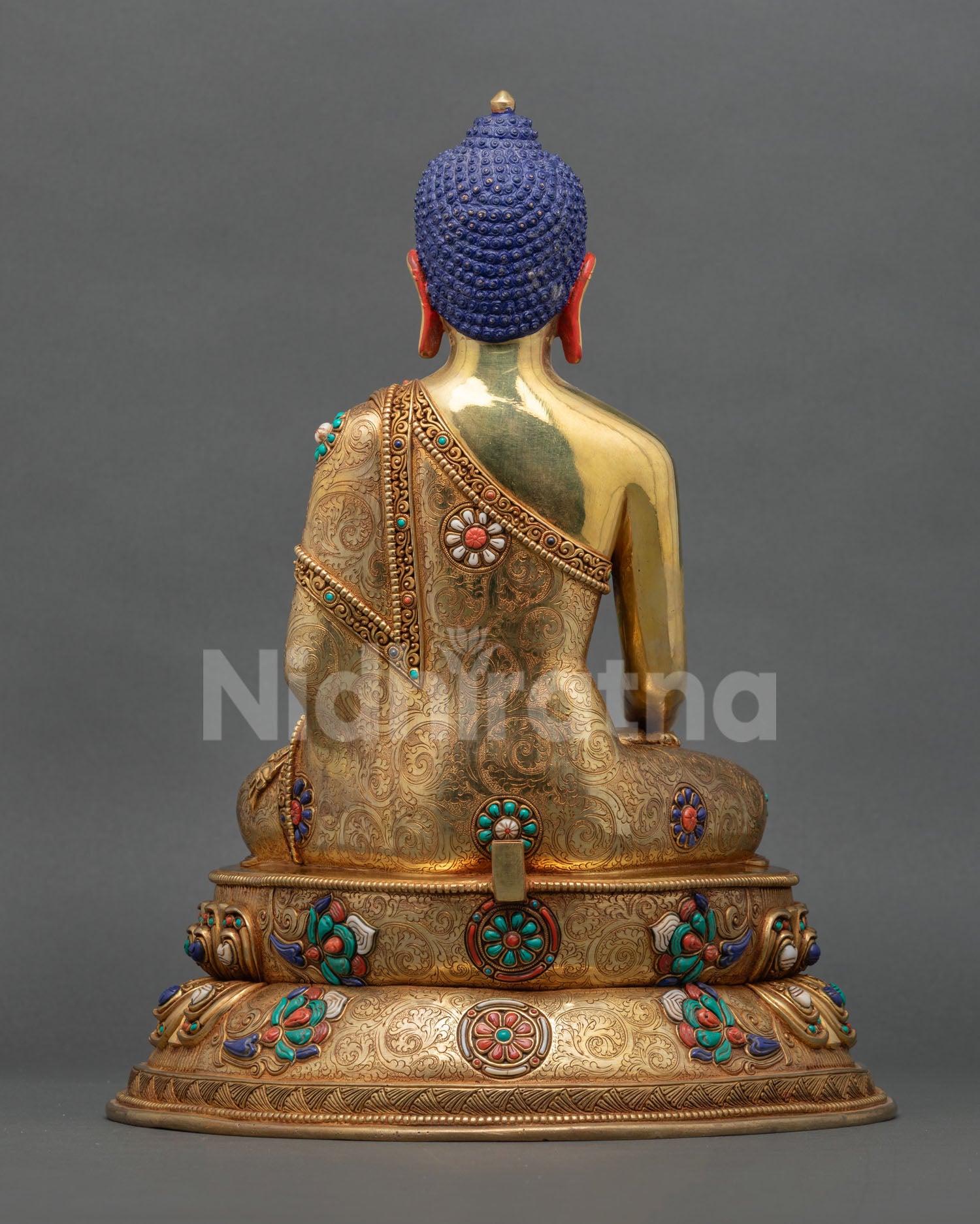 Back view of Buddha Shakyamuni statue showcasing copper craftsmanship, decorative halo, and traditional lost wax casting details.