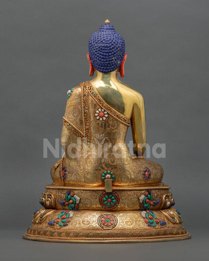 Back view of Buddha Shakyamuni statue showcasing copper craftsmanship, decorative halo, and traditional lost wax casting details.
