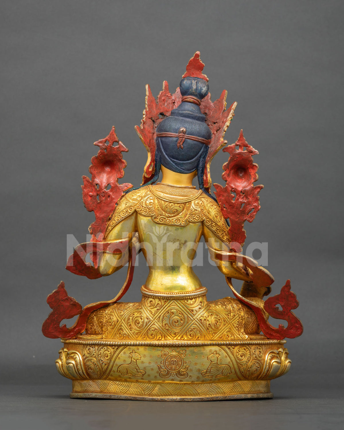 Back view of Buddhist Green Tara statue showing intricate gold carving and hand-finished details