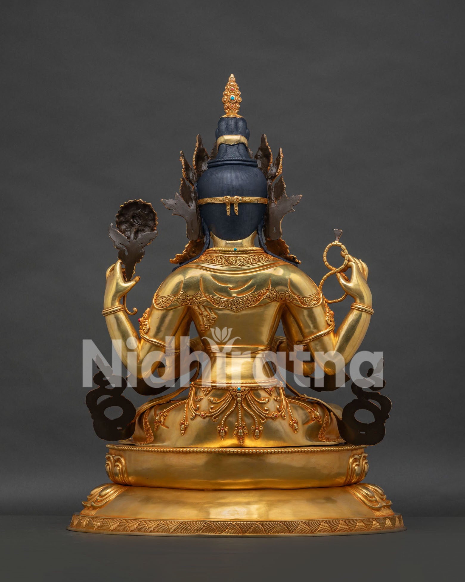 Back view of Chenrezig copper statue showing traditional Nepalese craftsmanship and sculptural details