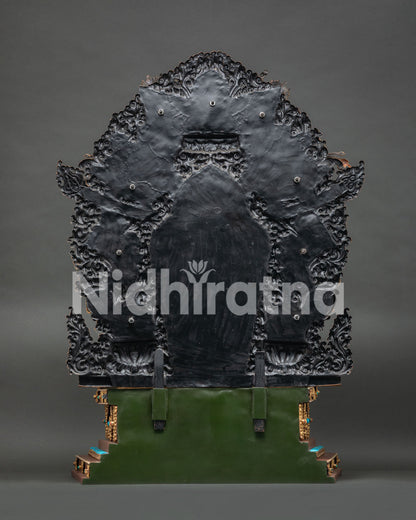 Back view of Chenrezig statue's celestial throne showing unfinished aureole structure